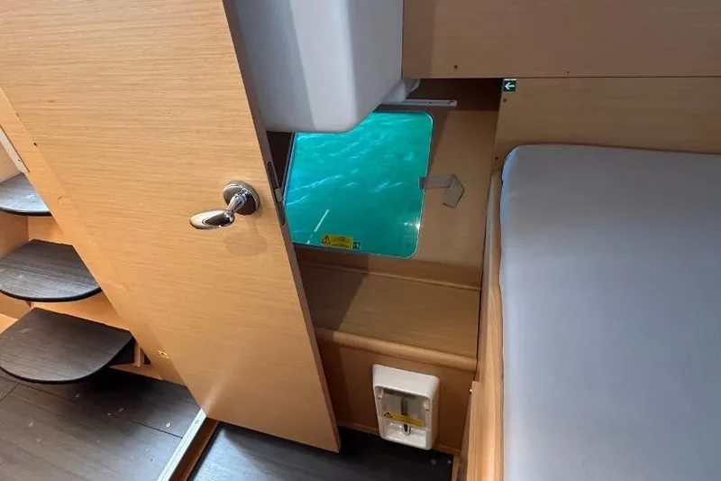 Nacrite Yacht Photos Pics Interior of 2018 Lagoon 380 catamaran with wooden finish and ocean view window.