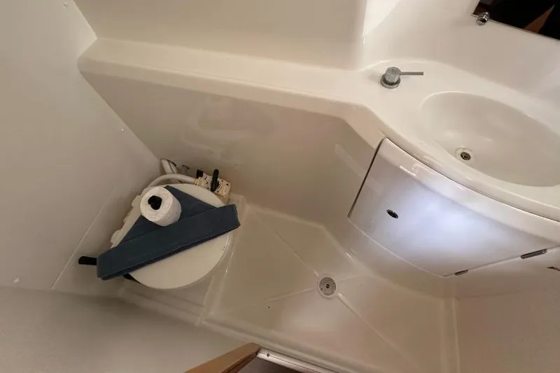 Nacrite Yacht Photos Pics Compact bathroom in 2018 Lagoon 380 catamaran with toilet and sink.