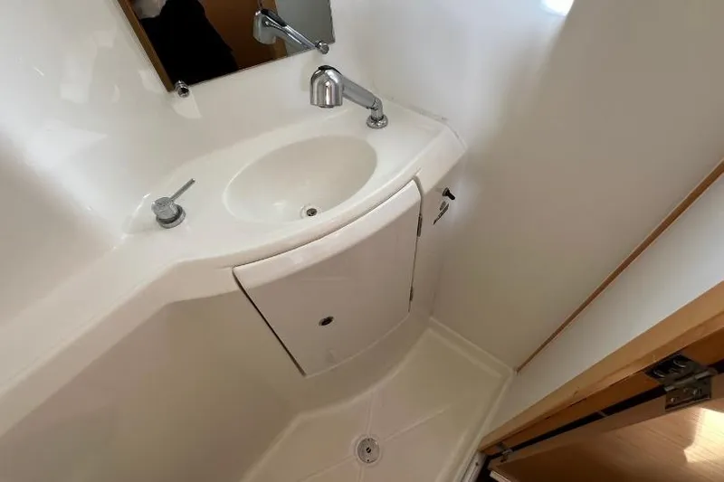 Nacrite Yacht Photos Pics Compact bathroom sink in 2018 Lagoon 380 yacht, featuring modern fixtures and storage.