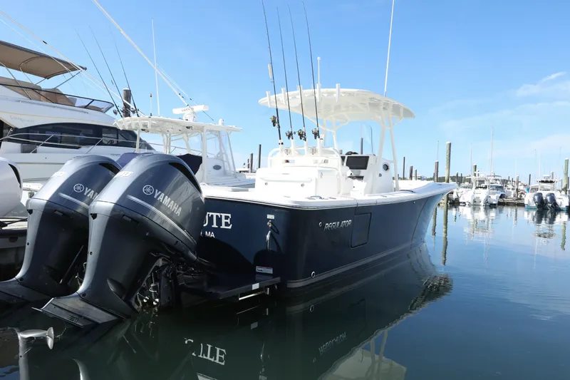 Resolute Yacht Photos Pics 2017 Regulator 31 boat with Yamaha engines docked in a marina.