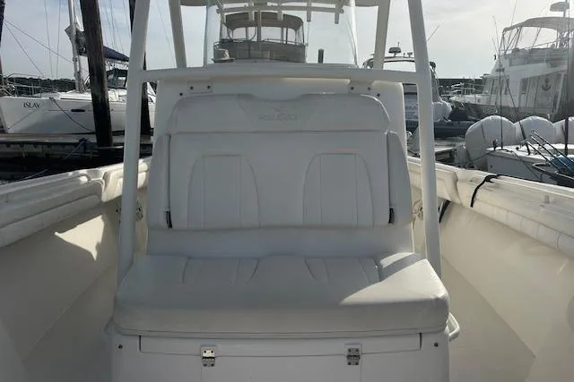 Resolute Yacht Photos Pics 2017 Regulator 31 boat with white seating at a marina.