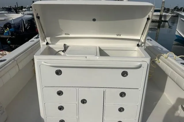 Resolute Yacht Photos Pics 2017 Regulator 31 boat with open storage compartment and drawers.