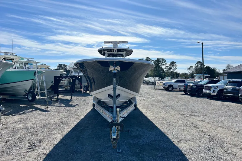  Yacht Photos Pics 2020 Tidewater 320 CC Adventure boat on trailer in sunny outdoor lot.