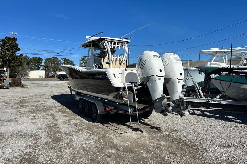 Yacht Photos Pics 2020 Tidewater 320 CC Adventure boat with dual engines on a trailer.