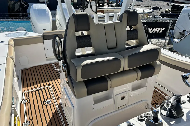  Yacht Photos Pics 2020 Tidewater 320 CC Adventure boat interior with dual seats and teak flooring.