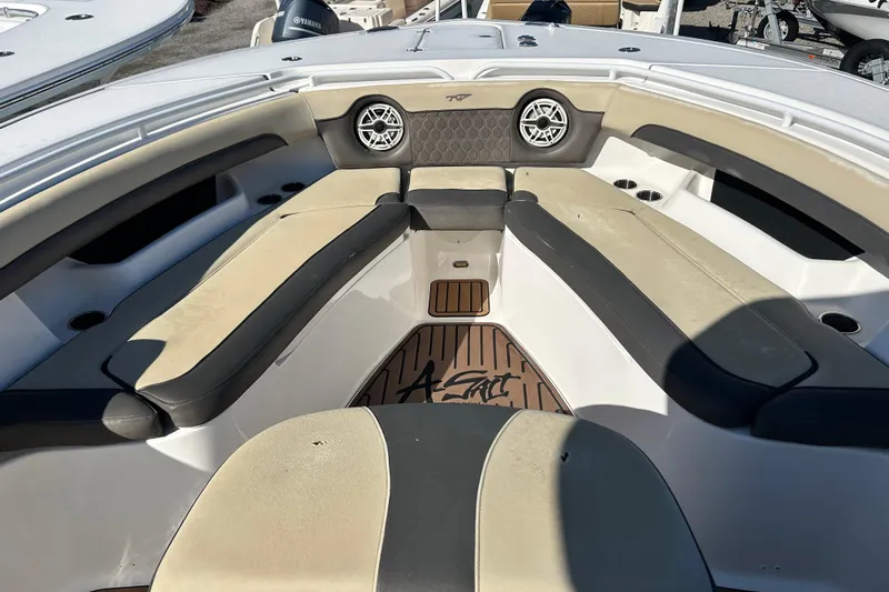  Yacht Photos Pics 2020 Tidewater 320 CC Adventure boat interior with cushioned seating and speakers.