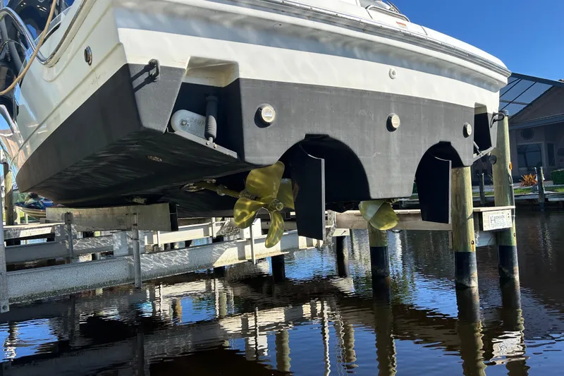 Wattever Yacht Photos Pics 2008 Formula 34 Performance Cruiser on lift, showcasing propellers and hull design.