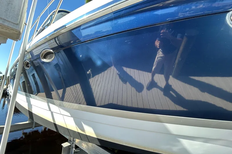 Wattever Yacht Photos Pics 2008 Formula 34 Performance Cruiser with reflective blue hull in marina setting.