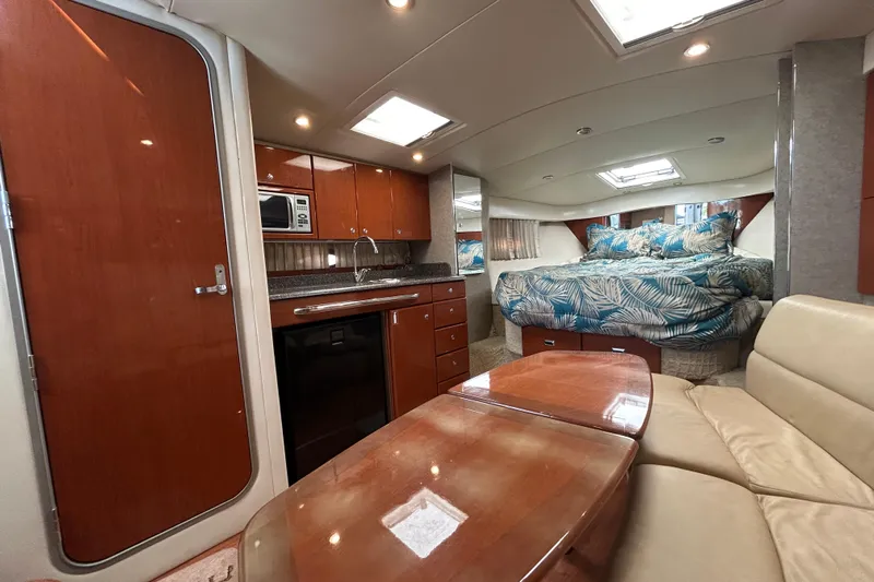 Wattever Yacht Photos Pics Interior of 2008 Formula 34 Performance Cruiser with kitchen, seating, and bed.