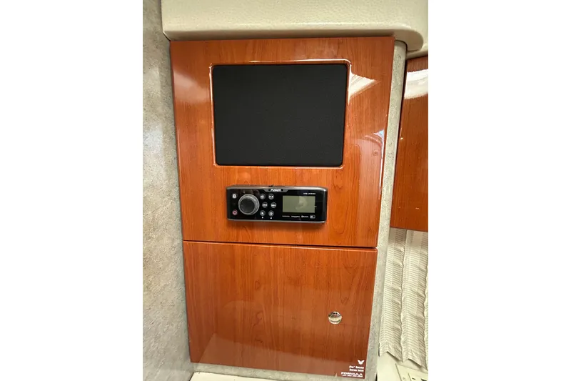 Wattever Yacht Photos Pics Wooden panel with a Fusion stereo system in a 2008 Formula 34 Performance Cruiser.