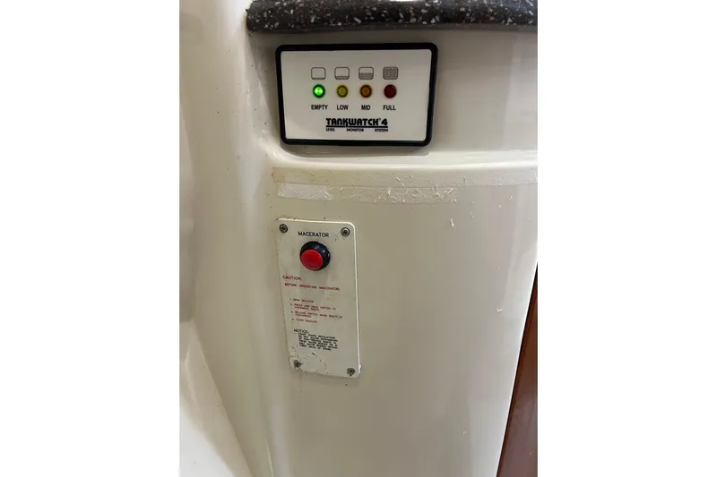 Wattever Yacht Photos Pics Control panel on 2008 Formula 34 Performance Cruiser, featuring tank level indicators and macerator button.