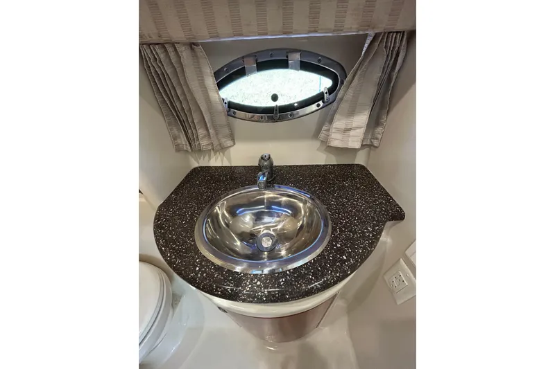 Wattever Yacht Photos Pics 2008 Formula 34 Performance Cruiser bathroom with sleek sink and countertop.