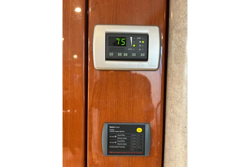 Wattever Yacht Photos Pics Control panel on 2008 Formula 34 Performance Cruiser, displaying temperature and system indicators.