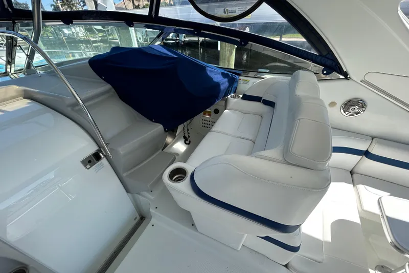 Wattever Yacht Photos Pics 2008 Formula 34 Performance Cruiser interior with white seating and blue accents.