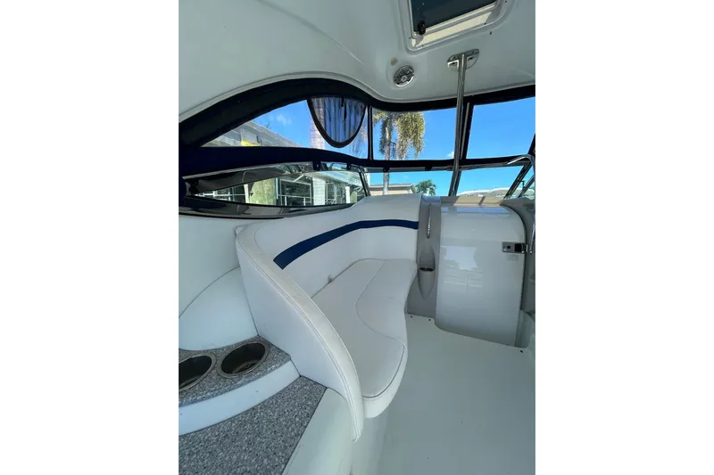 Wattever Yacht Photos Pics Interior of 2008 Formula 34 Performance Cruiser with white seating and blue accents.