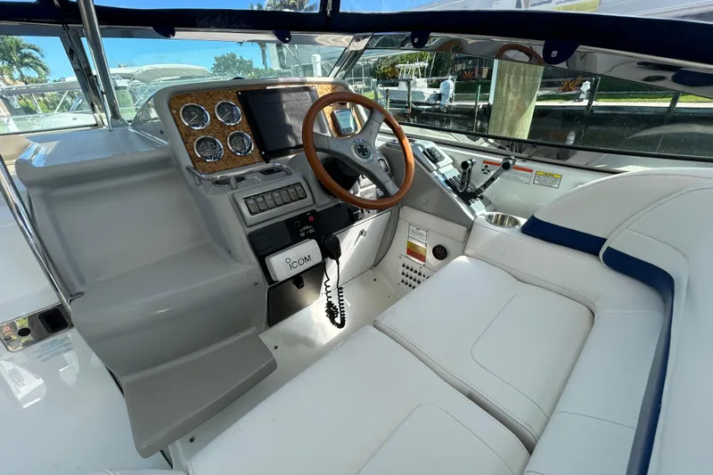 Wattever Yacht Photos Pics 2008 Formula 34 Performance Cruiser cockpit with wood-accented steering wheel and modern controls.