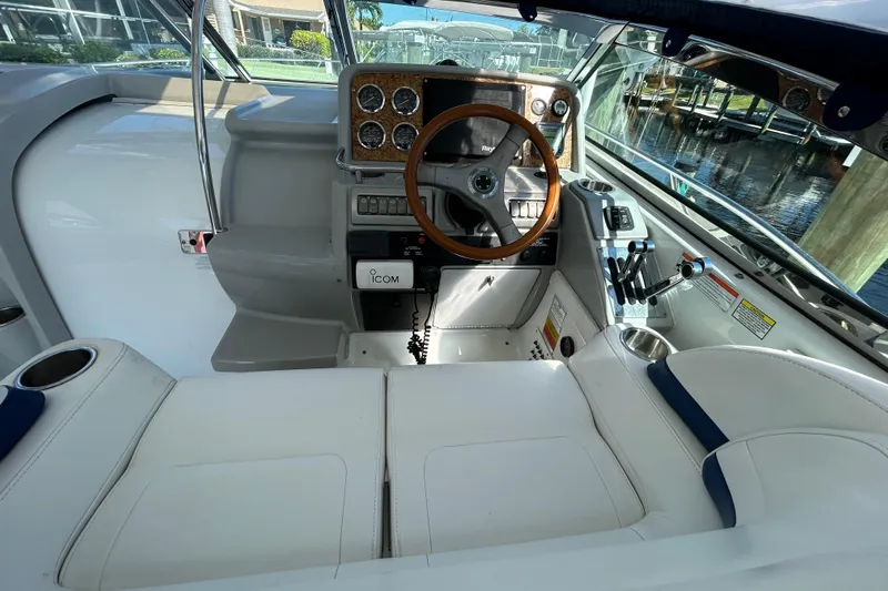 Wattever Yacht Photos Pics 2008 Formula 34 Performance Cruiser cockpit with wooden steering wheel and modern controls.