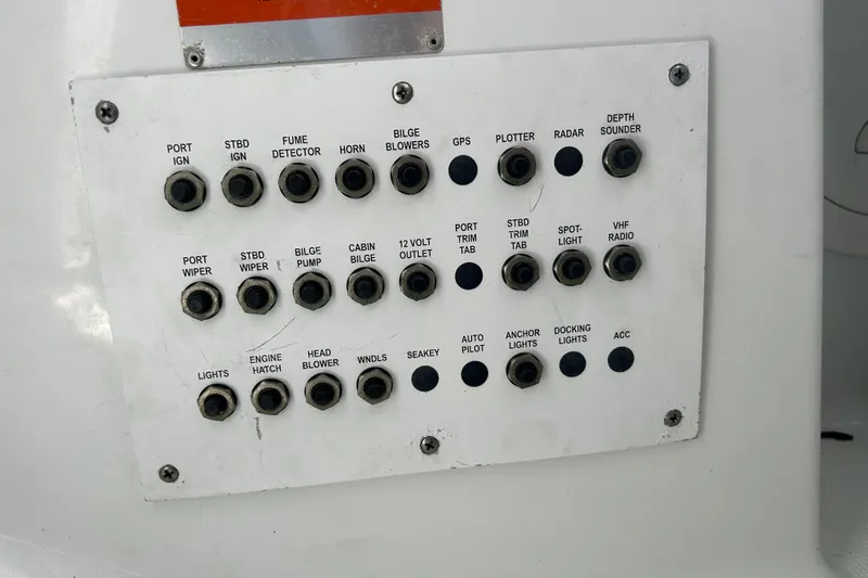 Wattever Yacht Photos Pics Control panel of a 2008 Formula 34 Performance Cruiser with labeled switches and buttons.