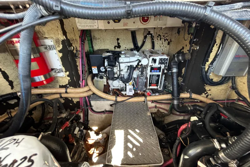 Wattever Yacht Photos Pics Engine compartment of a 2008 Formula 34 Performance Cruiser with visible wiring and components.