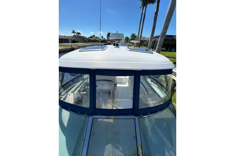 Wattever Yacht Photos Pics 2008 Formula 34 Performance Cruiser boat docked under clear blue sky.