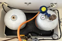 Two propane tanks with gauges and hoses in a Leopard 40 yacht, 2019 model.
