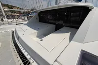 2019 Leopard 40 catamaran deck with seating and netting, docked at marina.