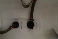Bilge area of 2019 Leopard 40 with hoses and fittings.