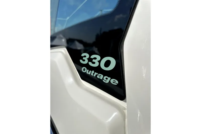  Yacht Photos Pics 2023 Boston Whaler OUTRAGE 330 boat model detail with sleek design.