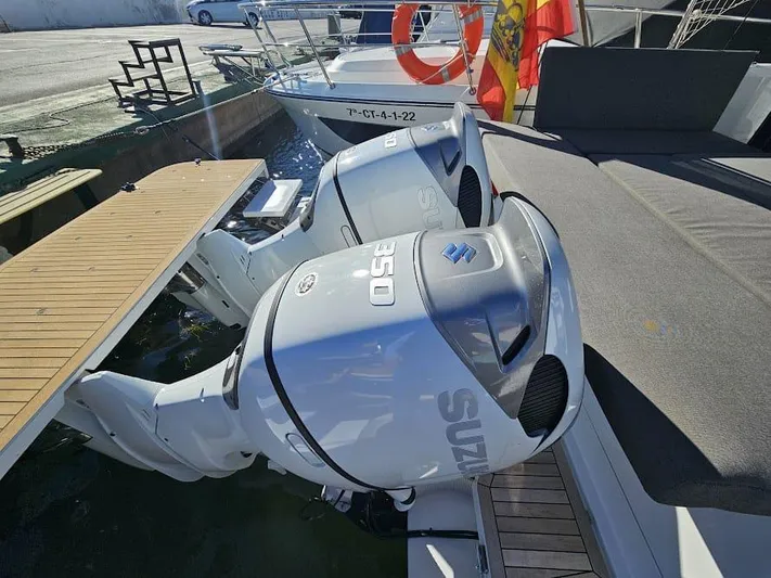  Yacht Photos Pics 2024 Sealine C390V boat with dual Suzuki outboard motors docked at marina.
