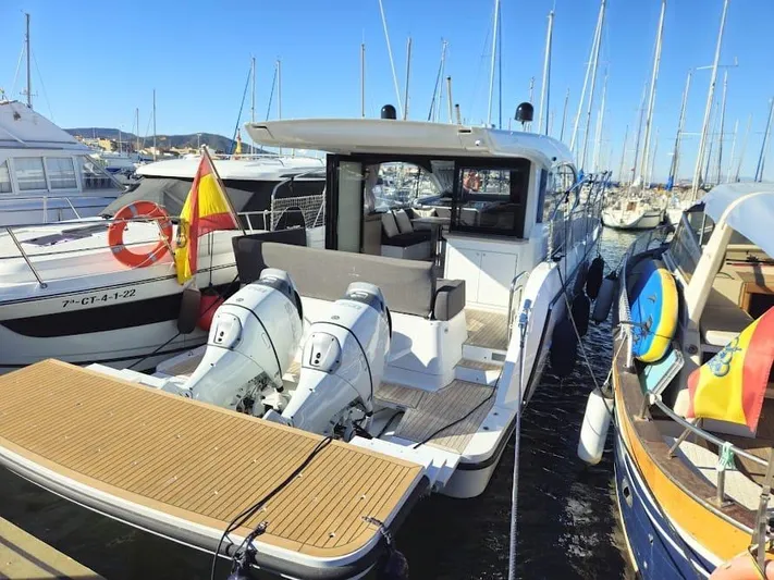  Yacht Photos Pics 2024 Sealine C390V yacht docked at marina with twin outboard engines.