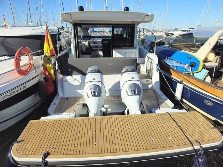  Yacht Photos Pics 2024 Sealine C390V yacht with dual outboard motors docked at a marina.