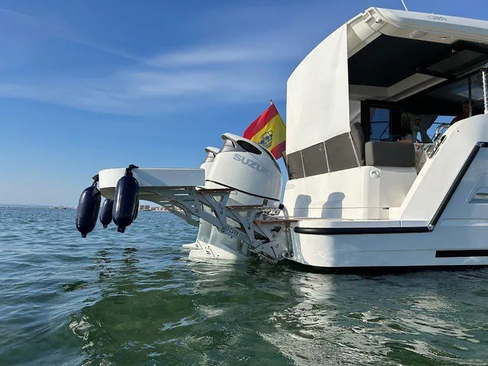  Yacht Photos Pics 2024 Sealine C390V yacht with Suzuki outboard motor on calm water.