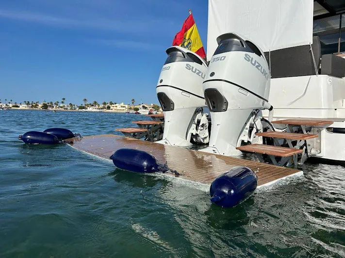  Yacht Photos Pics 2024 Sealine C390V boat with twin Suzuki outboard motors on water.