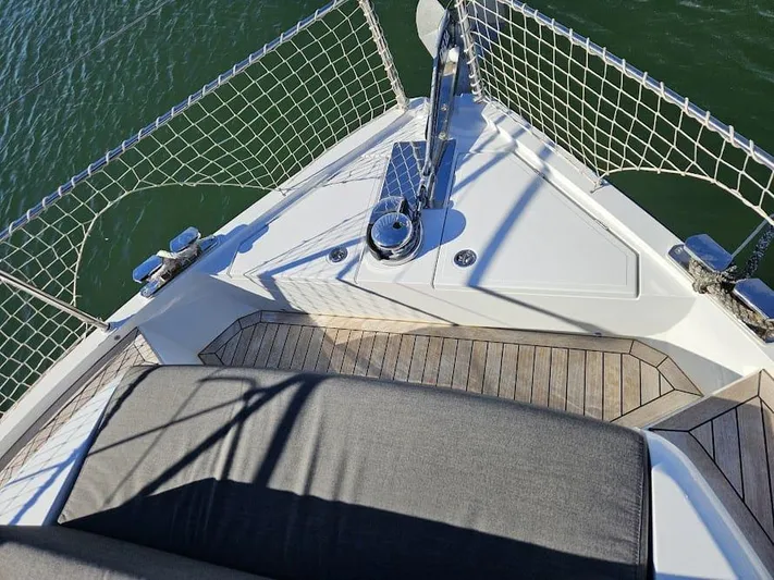  Yacht Photos Pics 2024 Sealine C390V yacht bow with teak decking and safety netting.
