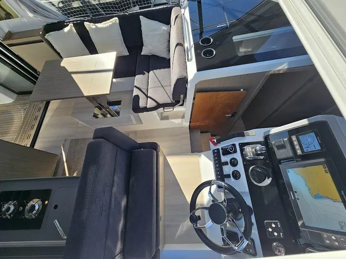  Yacht Photos Pics 2024 Sealine C390V yacht interior with modern seating, navigation controls, and sleek design.