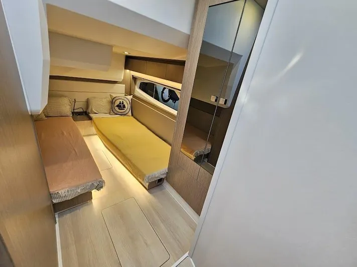  Yacht Photos Pics 2024 Sealine C390V cabin interior with modern design and cozy sleeping area.