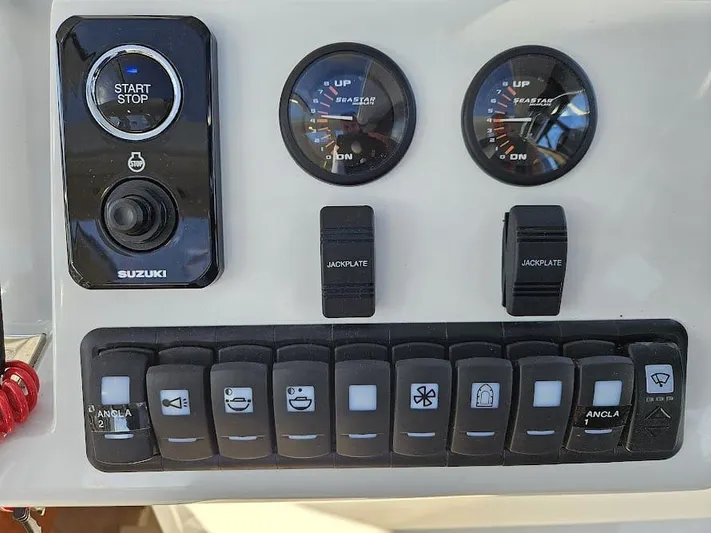  Yacht Photos Pics Control panel of 2024 Sealine C390V boat with Suzuki start-stop system and gauges.