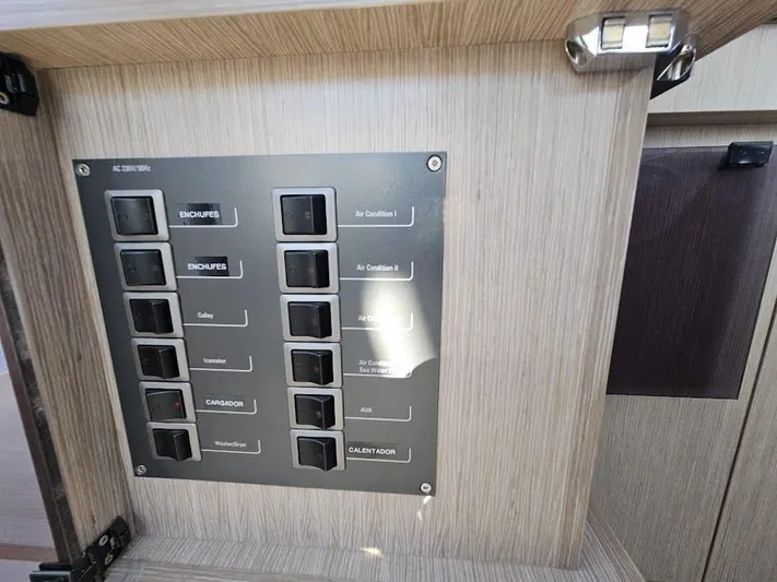  Yacht Photos Pics Control panel inside 2024 Sealine C390V yacht, featuring labeled switches for various functions.