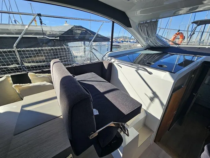  Yacht Photos Pics 2024 Sealine C390V yacht interior with modern seating and sleek design.