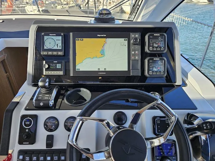 Yacht Photos Pics 2024 Sealine C390V yacht dashboard with navigation system and controls.