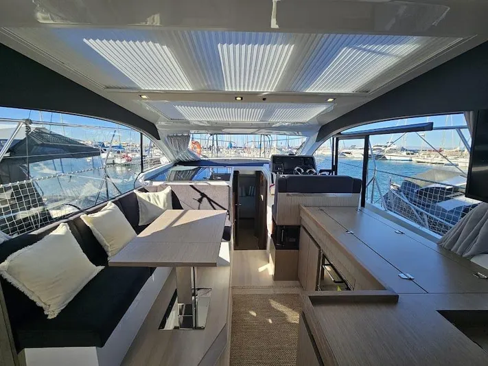  Yacht Photos Pics 2024 Sealine C390V yacht interior with modern design, spacious seating, and panoramic windows.