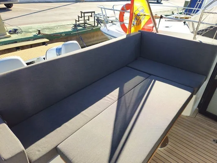  Yacht Photos Pics 2024 Sealine C390V yacht with spacious outdoor seating area.