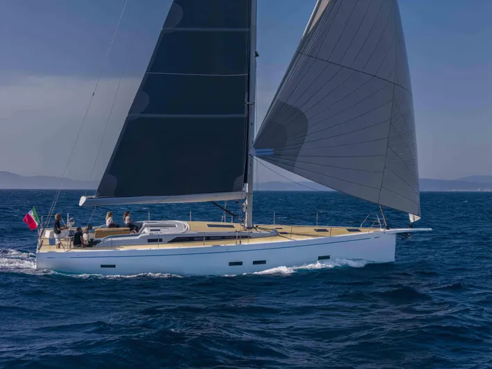  Yacht Photos Pics 2025 Grand Soleil 52 Performance yacht sailing on open sea with crew onboard.