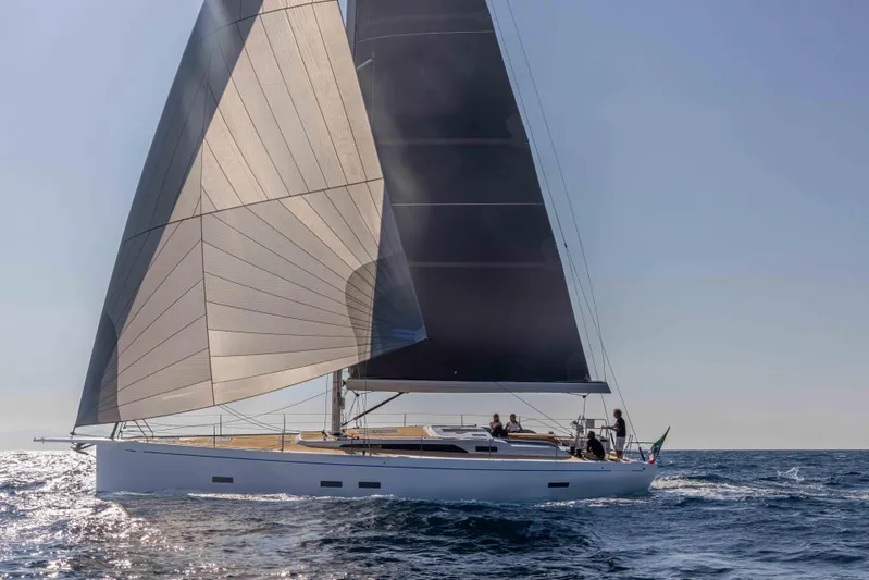  Yacht Photos Pics Grand Soleil 52 Performance 2025 sailing yacht on open sea, elegant design and sleek sails.
