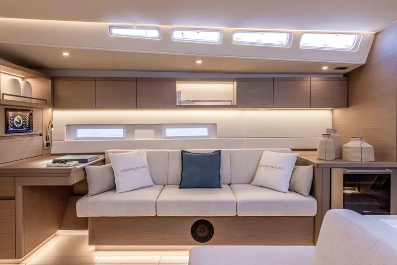  Yacht Photos Pics Luxurious interior of 2025 Grand Soleil 52 Performance yacht with modern design and cozy seating.