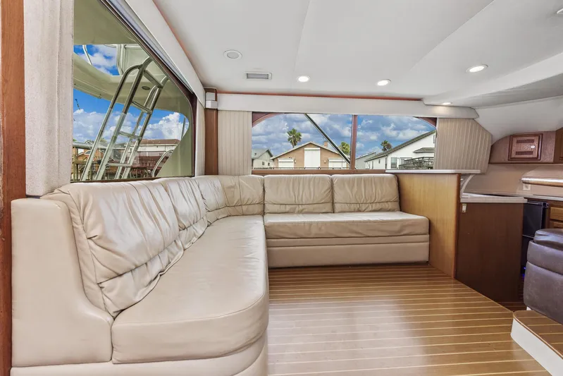 High Interest Yacht Photos Pics Interior of a 2002 Cabo Convertible Painted yacht with beige leather seating.