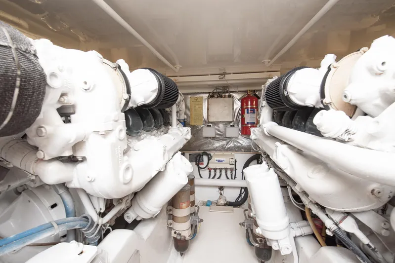 High Interest Yacht Photos Pics Engine room of a 2002 Cabo Convertible Painted boat.