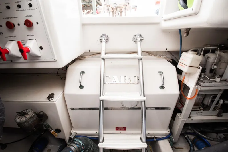 High Interest Yacht Photos Pics 2002 Cabo Convertible Painted boat interior with ladder and control panel.