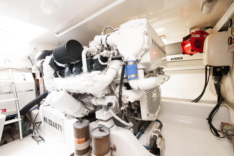 High Interest Yacht Photos Pics 2002 Cabo Convertible Painted engine room with white machinery and equipment.