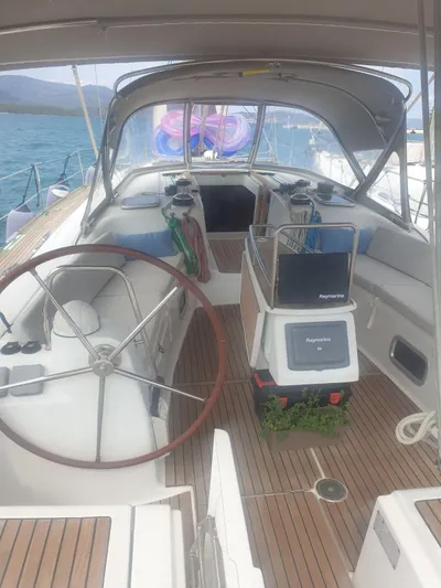  Yacht Photos Pics 2008 Beneteau Oceanis 50 sailboat cockpit with wooden deck and steering wheel.